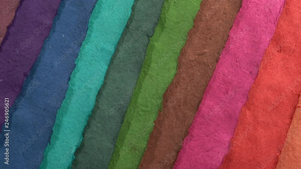 colorful sheets of handmade Huun paper created by Mayan artisans in Mexico from a tree bark - top view pan colorful sheets of handmade Huun paper created by Mayan artisans in Mexico from a tree bark - top view pan