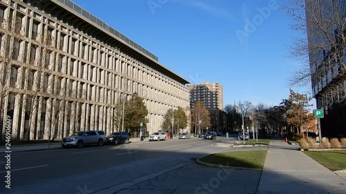 Wallpaper Mural 4K Traffic In Front Of Large Building Structure With Other City Buildings Torontodigital.ca