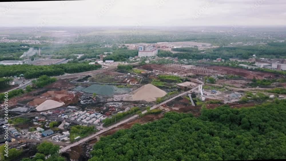 drone is flying over suburban area with forest, large area with construction, aerial view drone is flying over suburban area with forest, large area with construction, aerial view