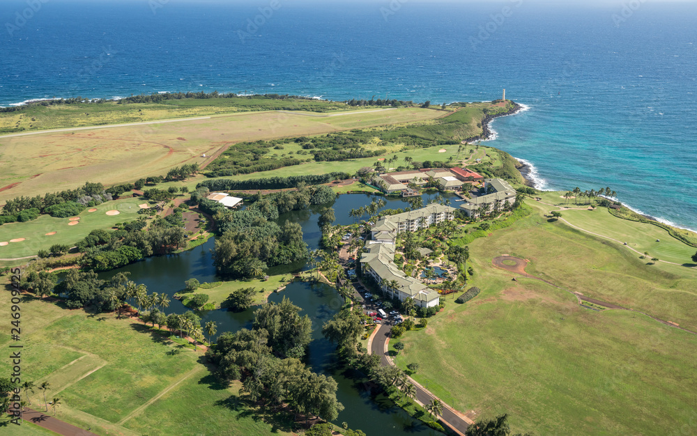 Aerial view of hotel and landscape of hawaiian island of Kauai from helicopter flight