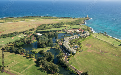 Aerial view of hotel and landscape of hawaiian island of Kauai from helicopter flight