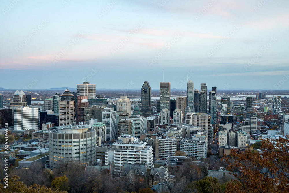 Obraz premium Montreal skyline, with the iconic buildings of the Downtown and the CBD business skyscrapers taken from the Mont Royal Hill. Montreal is the main city of Quebec, and the second city in Canada