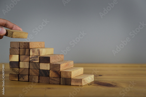 Hand Closer up hands of businessmen,stacking wooden blocks into steps,Concept of business growth success - image