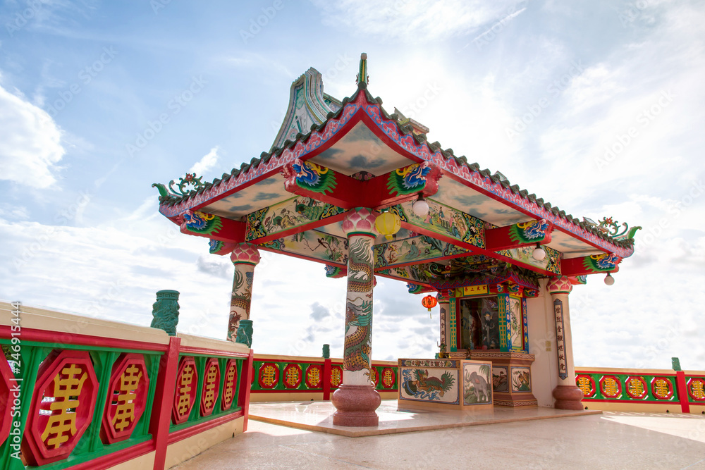 Ancient Chinese Shrine with Big Three face Guanyin statue and sky background,public landmark for tourist Ancient Chinese Shrine with Big Three face Guanyin statue and sky background,public landmark for tourist