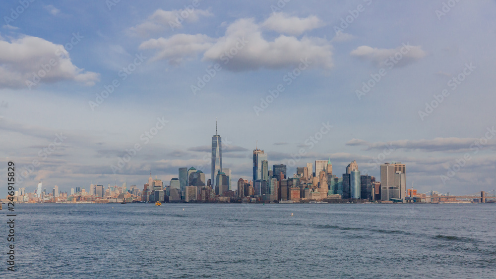 Buildings and skyscrapers of downtown Manhattan over water, in New York City, USA Buildings and skyscrapers of downtown Manhattan over water, in New York City, USA