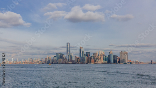 Buildings and skyscrapers of downtown Manhattan over water, in New York City, USA