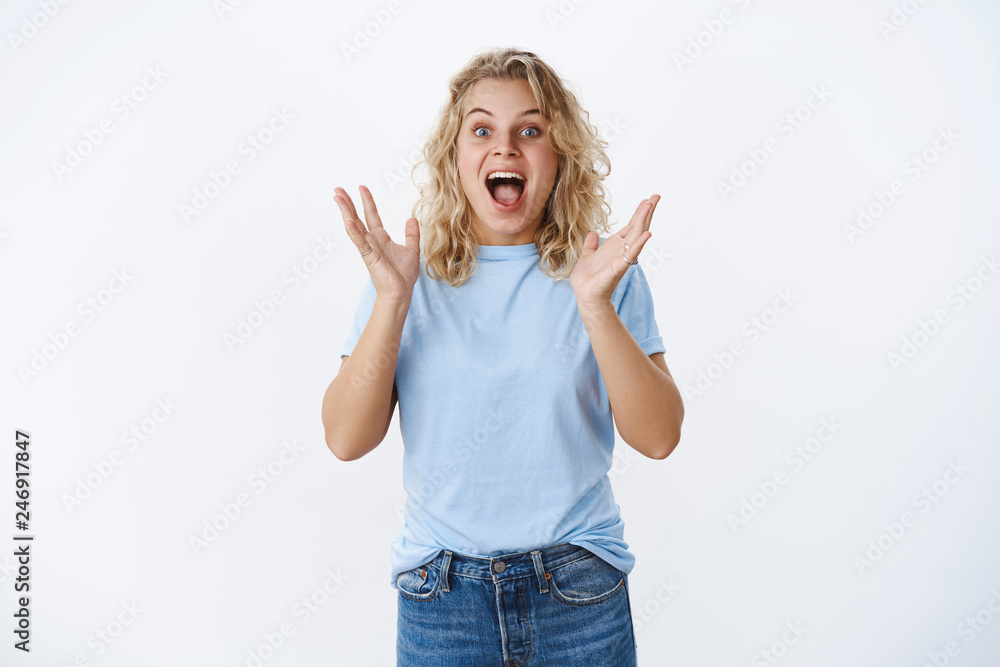 Girl screaming from happiness and excitement as seeing favorite pop singer reacting thrilled and overwhelmed raising hands from surprise and positive emotions yelling in joy and amazement Girl screaming from happiness and excitement as seeing favorite pop singer reacting thrilled and overwhelmed raising hands from surprise and positive emotions yelling in joy and amazement