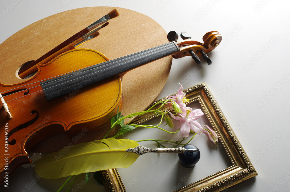 Fototapeta premium Art palette, brushes, violin, pen, notebook