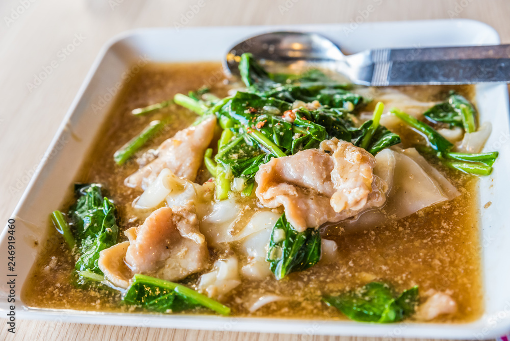 Rat na, Thai style stir-fried wide rice noodle with gravy saurce Rat na, Thai style stir-fried wide rice noodle with gravy saurce