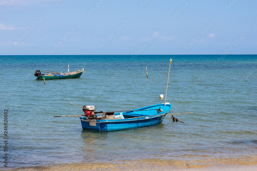 Local Fisherman Boats on the sea with bright sky in background in the afternoon at Koh Mak Island in Trat, Thailand.