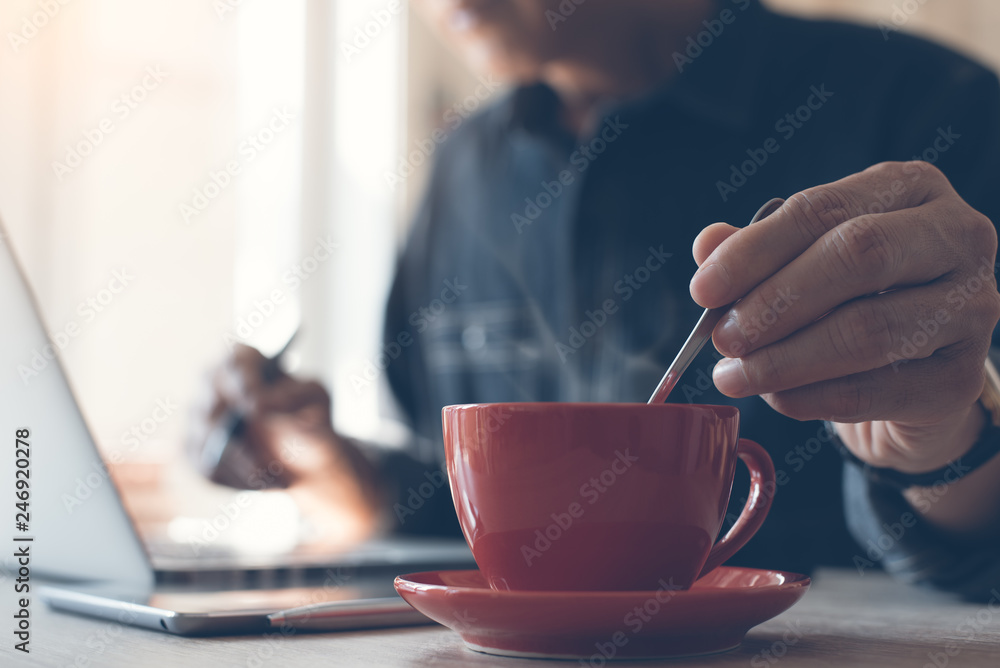 Man working and drinking coffee Man working and drinking coffee