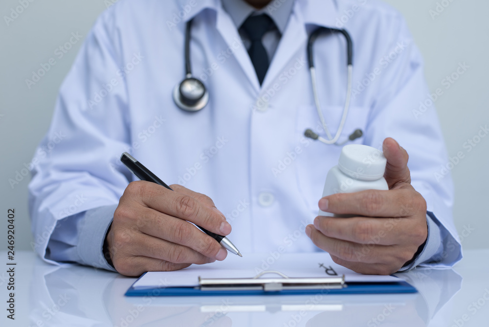 Doctor writing prescription Doctor writing prescription