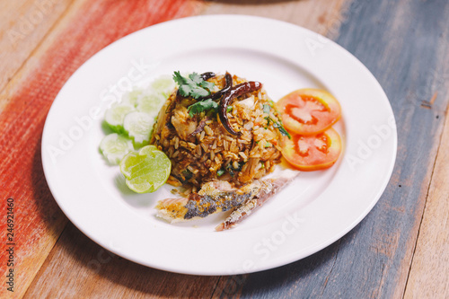 Fried rice Mackerel Paste with Thai Mackerel and that topping with Fried Chili. Served with Mackerel, Cucumber, Tomato and Lime.