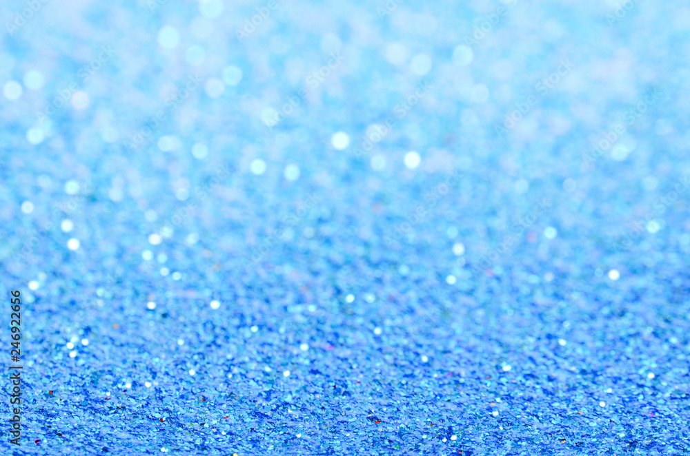 Obraz premium Blue glitter texture with bokeh, christmas abstract background.