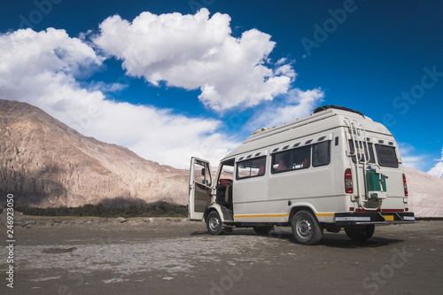 A traveller van parking in the middle of Nubra Valley a travel destination in Leh Ladakh, India.