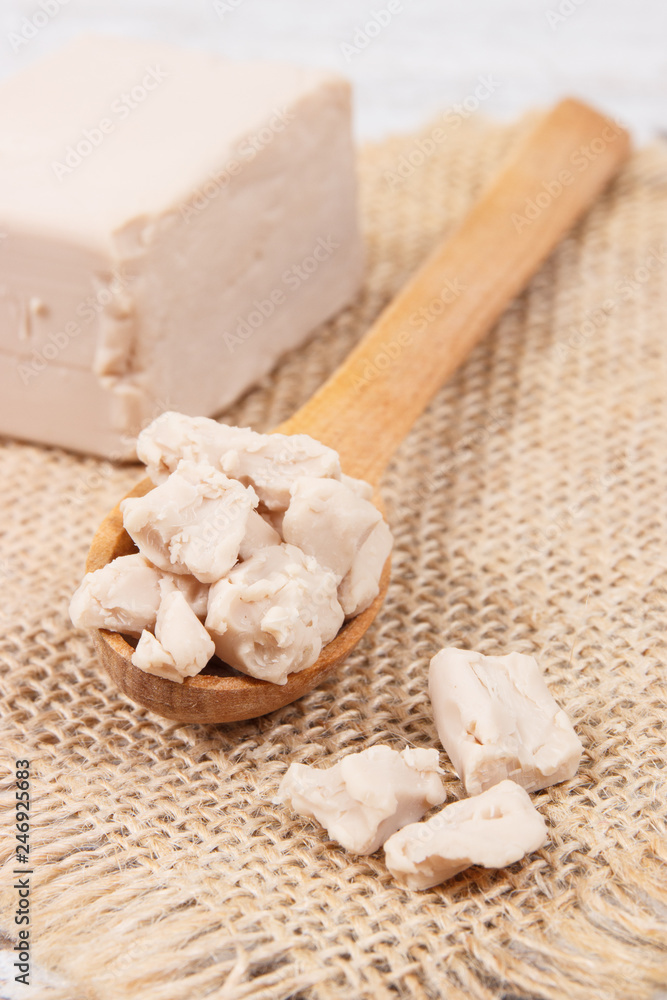 Fresh crumbled yeast for baking or preparing sourdough Fresh crumbled yeast for baking or preparing sourdough