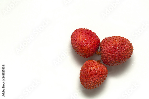 Three Fresh juicy Lychees in a pile on a white background. Lychee isolated on white background. Delicious fruit 
