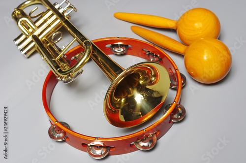 Trumpet, maracas, tambourine. Musical instruments