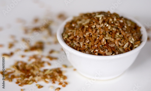 Brown rice on white background. 