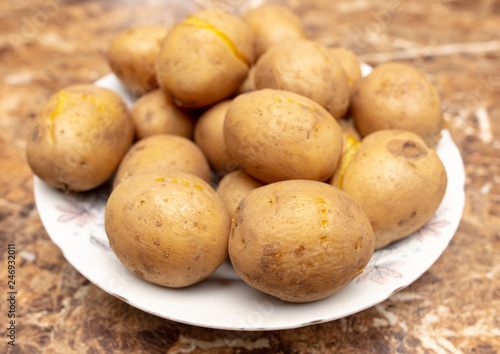 Boiled potatoes in a plate on the table