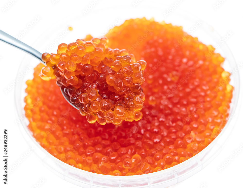 Spoon in red caviar on a white background Spoon in red caviar on a white background