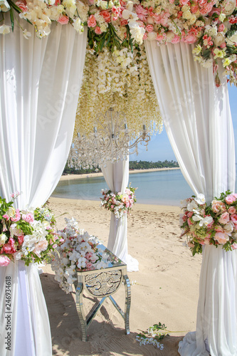Fototapeta Naklejka Na Ścianę i Meble -  Wedding set up on beach. Tropical outdoor wedding party on beach
