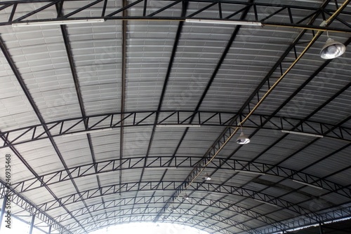 Large steel roof ..With strong sunlight reflected in the back.