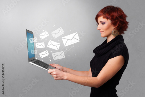 Man holding laptop with business communication concept 