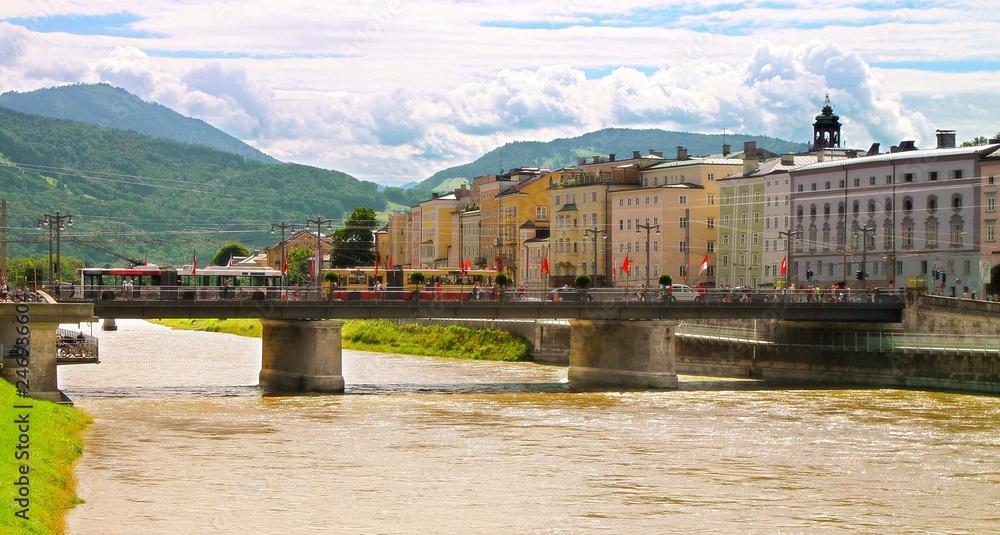 Vibrant landscape view of bridge and river in summer Salzburg of Austria