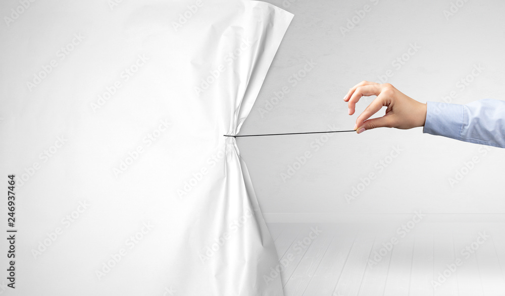 hand pulling white paper curtain, changing scene concept - obrazy, fototapety, plakaty 
