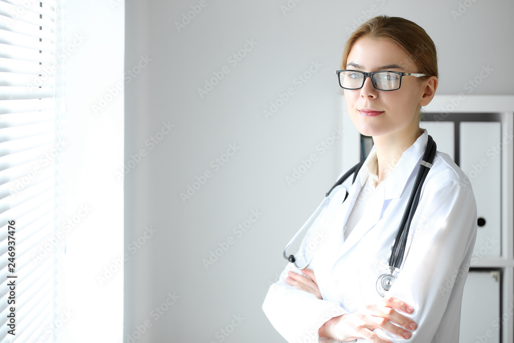 Doctor woman at work. Portrait of female physician at hospital office. Medicine and healthcare concept Doctor woman at work. Portrait of female physician at hospital office. Medicine and healthcare concept