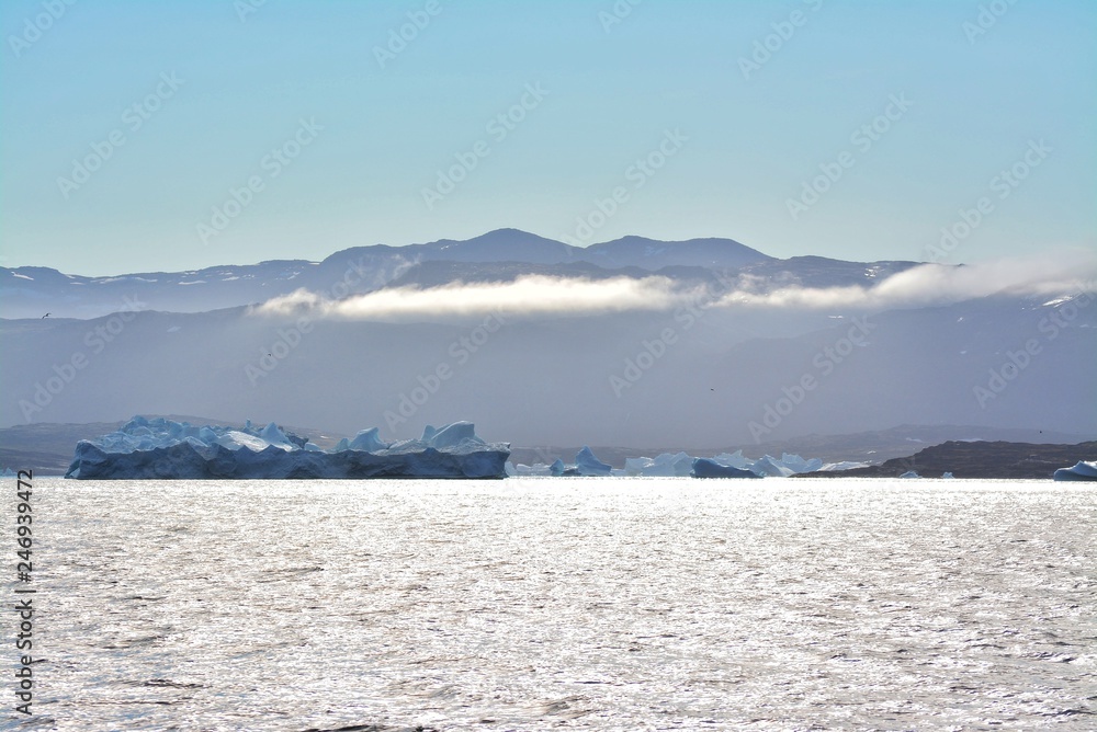 Disko Bay, Greenland - July - boat trip in the morning over the arctic sea - cold and fresh air and big beautiful icebergs, quiet moments in a wonderful nature