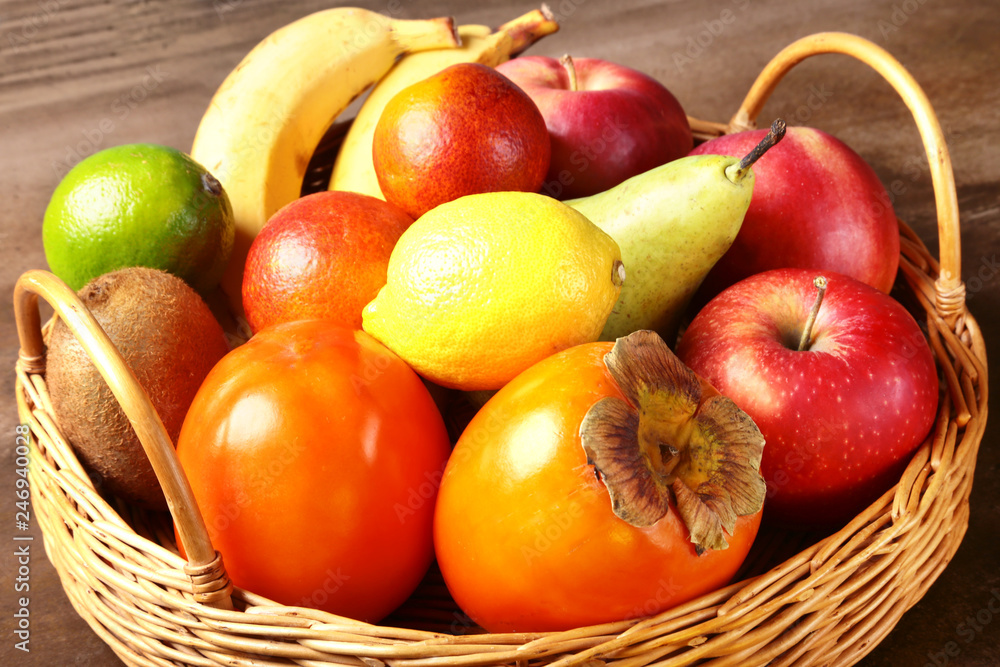 Fresh mixed exotic fruits in basket. Fruits background. Healthy eating, dieting. Fresh mixed exotic fruits in basket. Fruits background. Healthy eating, dieting.