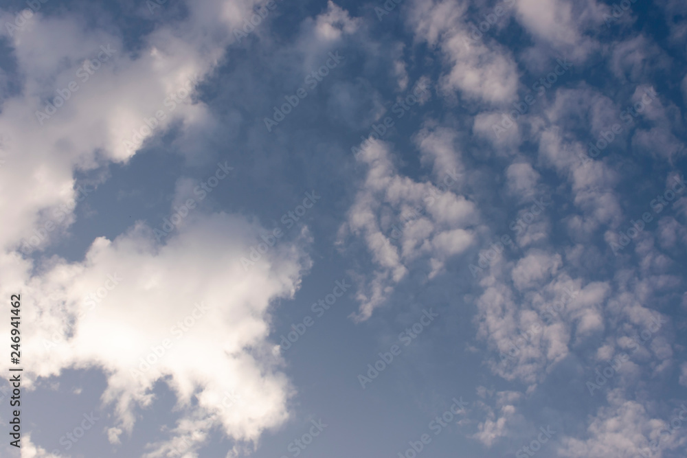 Fototapeta premium Blue sky background and white clouds soft focus, and copy space