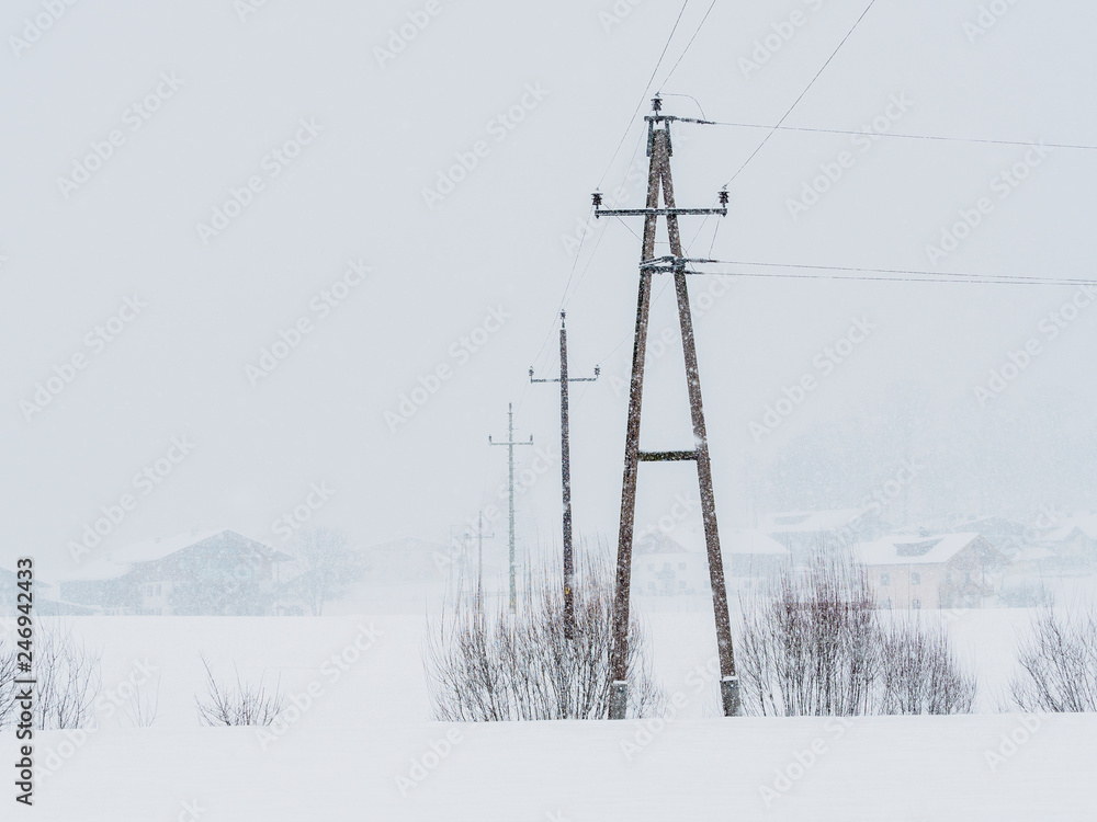 Power lines in the snowstorm in Ebbs, Tirol, Austria Power lines in the snowstorm in Ebbs, Tirol, Austria