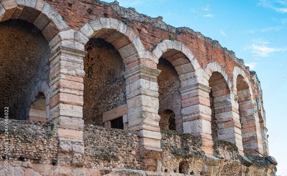 Arches and details of famous ancient roman amphitheatre Arena di Verona, Italy.