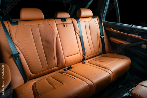 Red leather car seats, back passengers seats, modern comfortable cockpit © gargantiopa