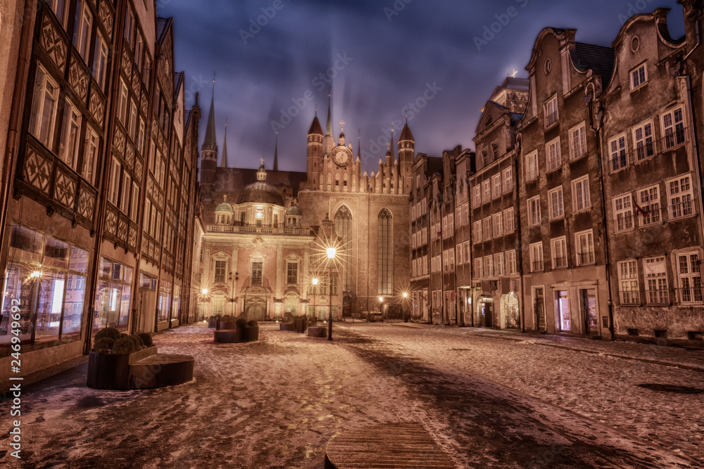 Gdansk winter street and view on Royal Chapel and St Mary's Church, Poland