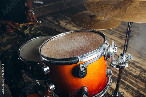 close up photo of a rofessional drum set . live music concept.musical instrumnet after rain. raindrops on drum