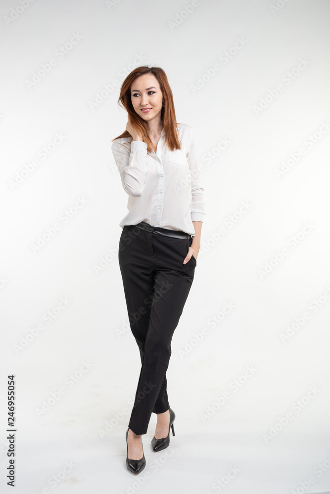 Portrait of fashionable beautiful asian woman in elegant clothes over white background Portrait of fashionable beautiful asian woman in elegant clothes over white background