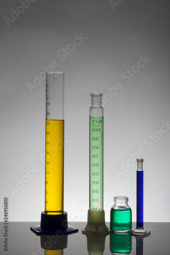 Liquid in laboratory bottles. Scientific biochemical laboratory. Colorful liquid.