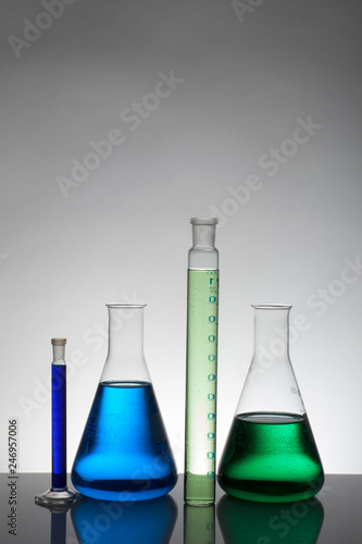 Liquid in laboratory bottles. Scientific biochemical laboratory. Colorful liquid.