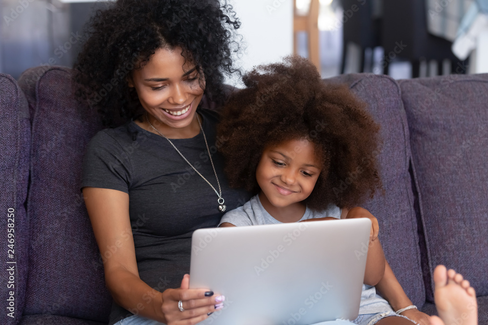 Curious Preschool African Mixed Race Girl Using Laptop at Home