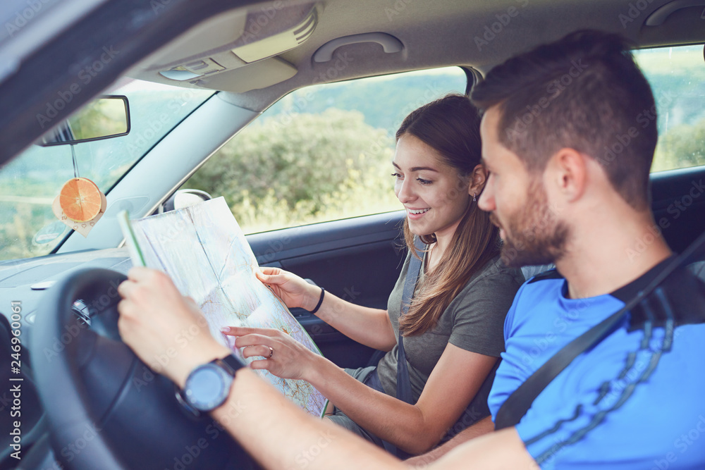 Happy couple traveling by car in the summer. Happy couple traveling by car in the summer.