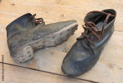 Obraz na plátně leather boots with soles with nails to walk on ice used by soldi