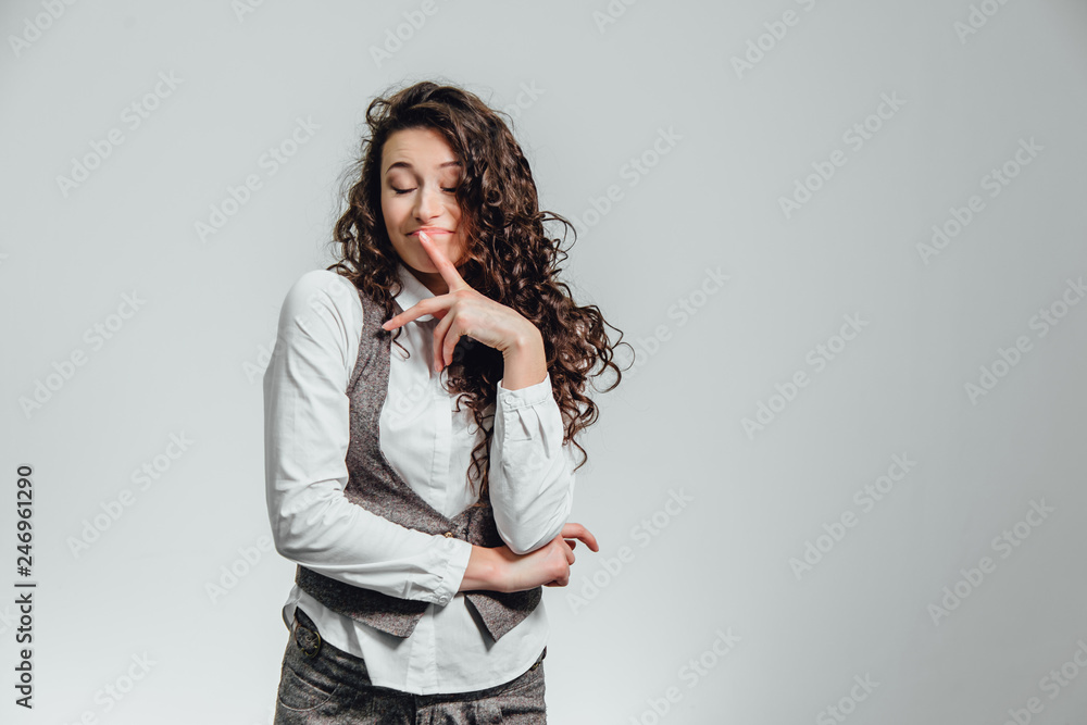 Portrait of attractive business woman on white background. With plenty of copy space. With a beautiful curly hair. Portrait of attractive business woman on white background. With plenty of copy space. With a beautiful curly hair.