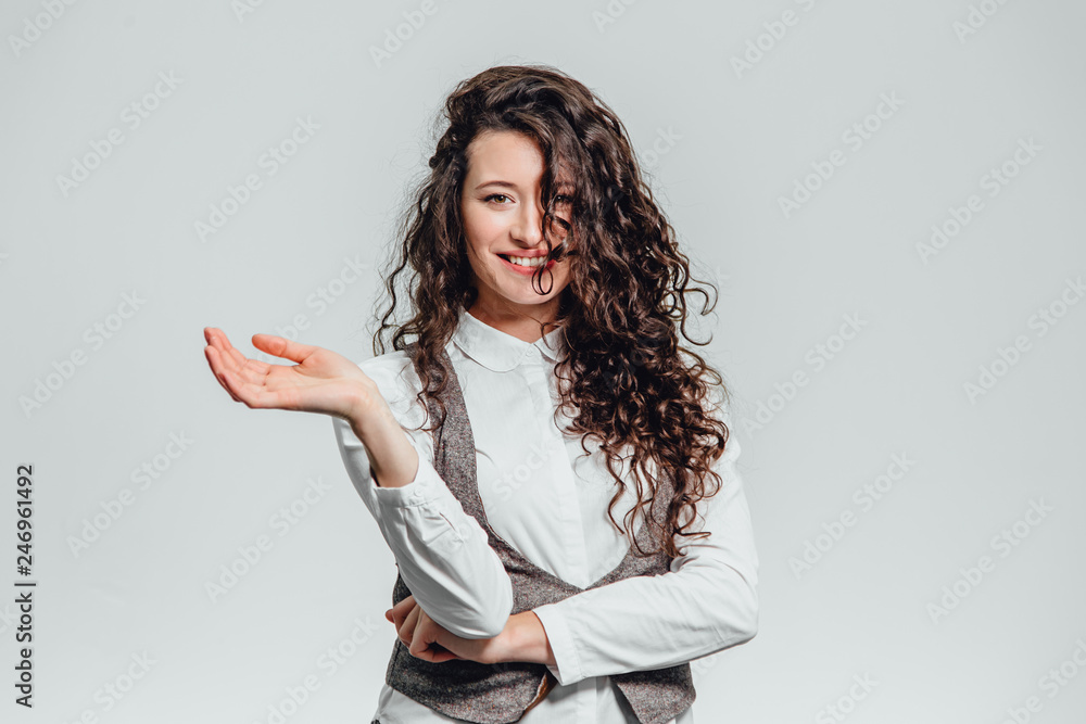 Portrait of attractive business woman on white background. With plenty of copy space. With beautiful curly hair Portrait of attractive business woman on white background. With plenty of copy space. With beautiful curly hair