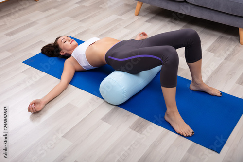 Fotografi Young Woman Practicing Yoga With Bolster