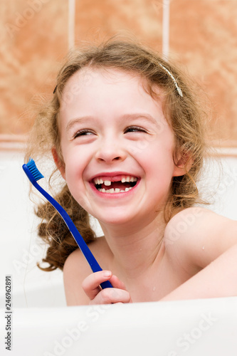 Laughing happy child lost primary tooth