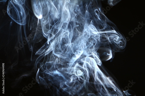 wonderful swirl contrast blue smoke on the black background.